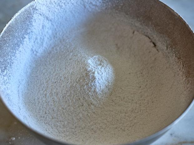 chocolate cookie ingredients sifted into a bowl