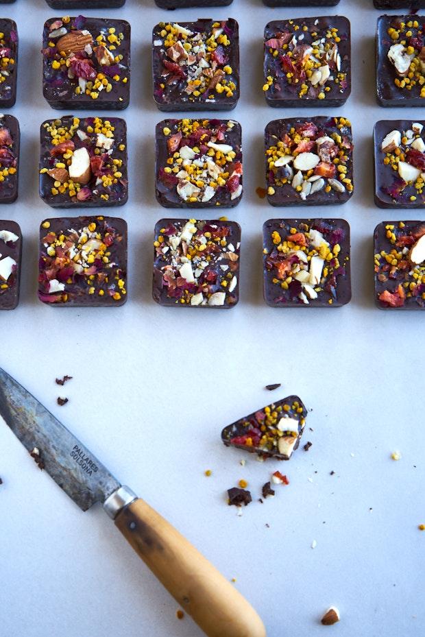 chocolate energy bites alongside a wood handled paring knife