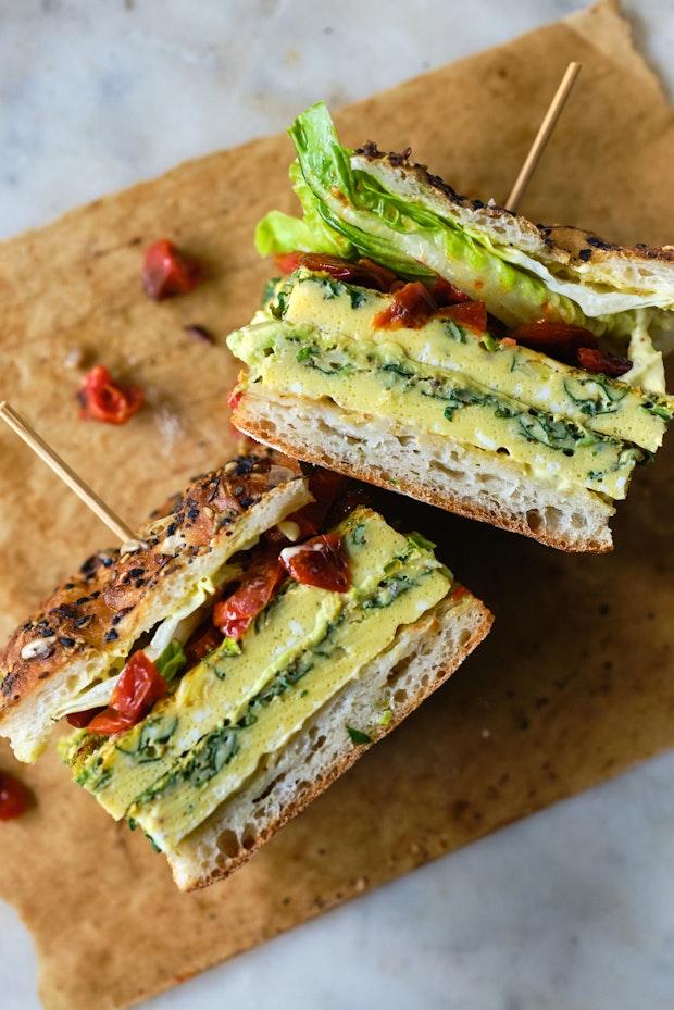 a frittata sandwich on parchment paper