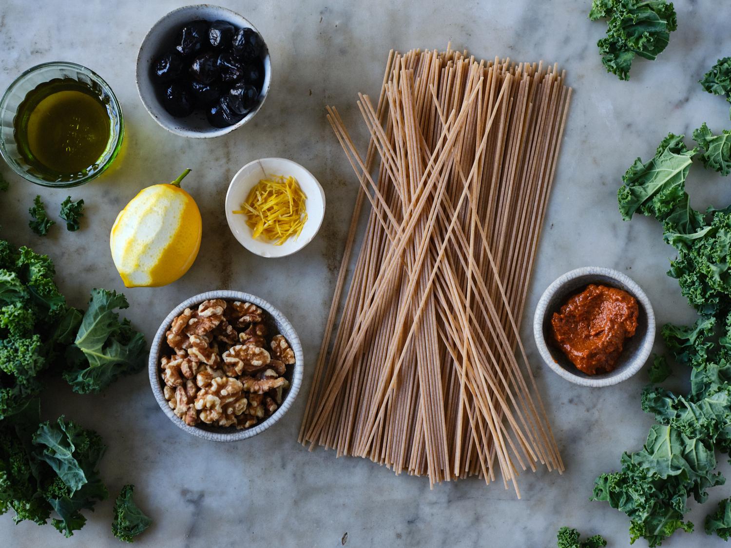 harissa spaghetti ingredients arranged in bowls on counter