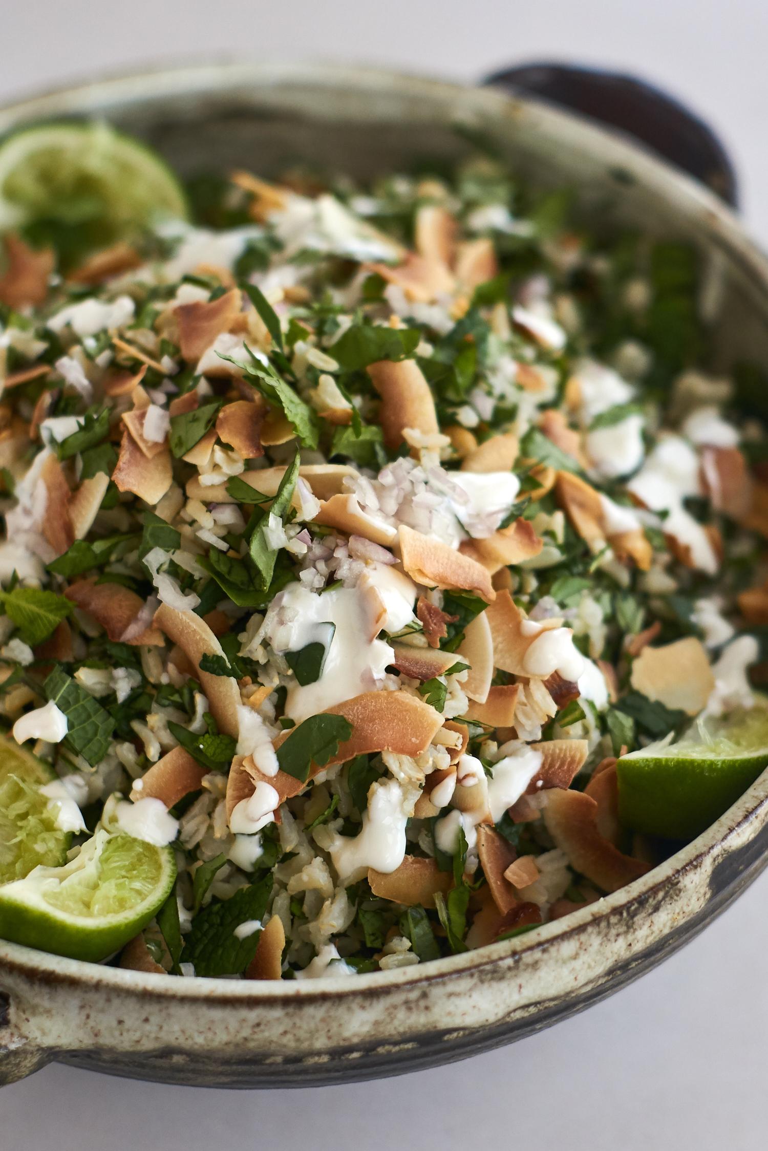 rice salad recipe filled with lots of herbs and topped with peanuts