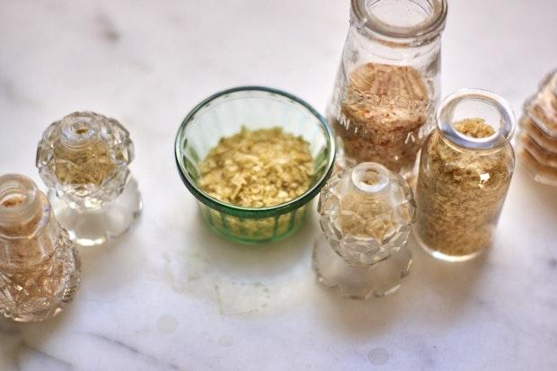 A range of citrus salts in vintage glass shakers and jars
