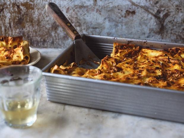 Mushroom Lasagna in a baking pan being served with a spatula