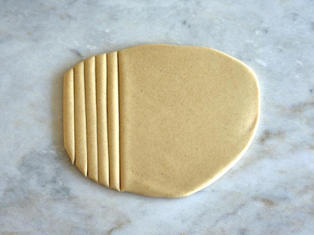 pasta dough on a marble countertop