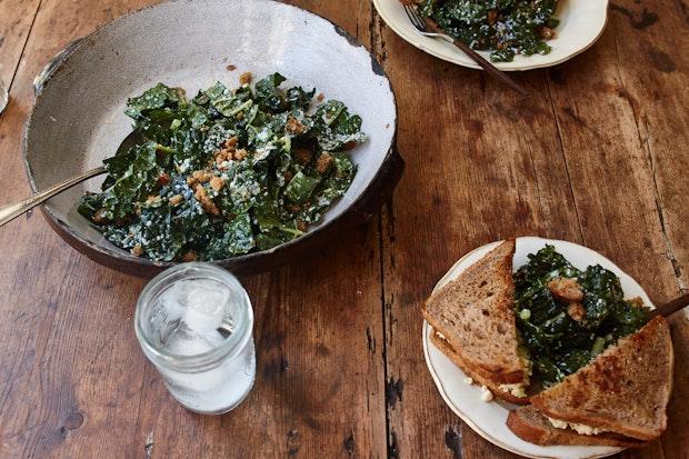 kale salad topped with breadcrumbs in a large bowl