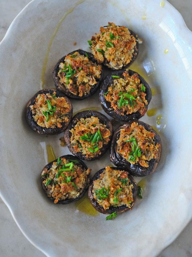 stuffed mushrooms in a white serving dish