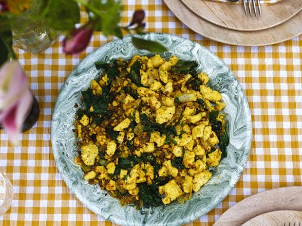 tofu scramble served on a plate on a picnic table