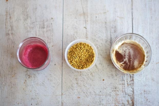 small bowls filled with toppings like honey and bee pollen for yogurt bowls