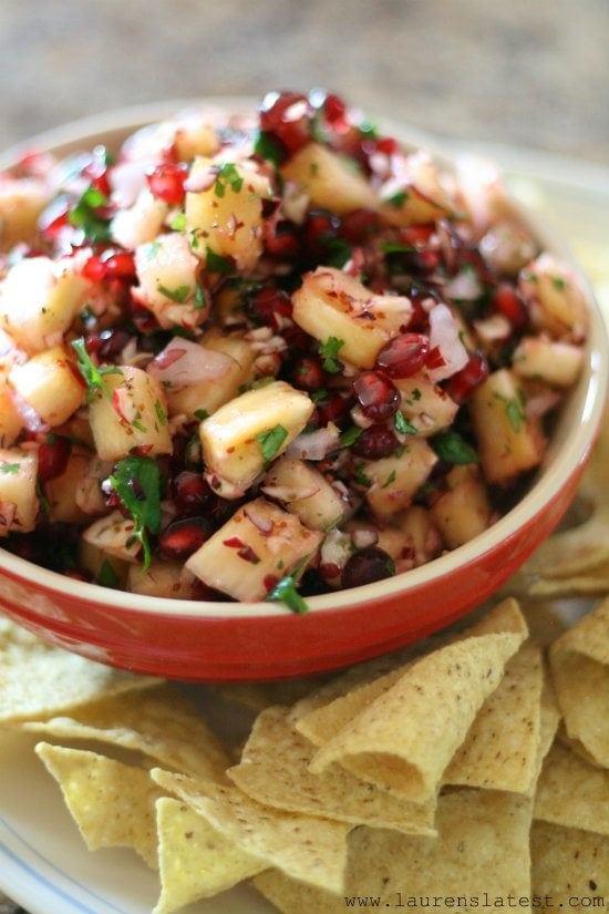 cranberry salsa in a bowl with chips on the side