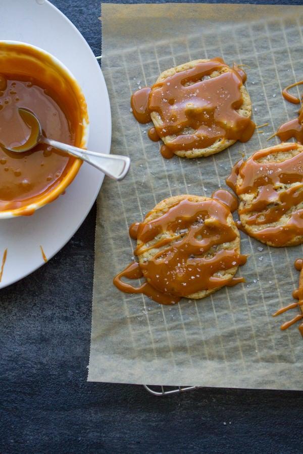 Salted Caramel Chocolate Chip Cookies on a cooling wrack