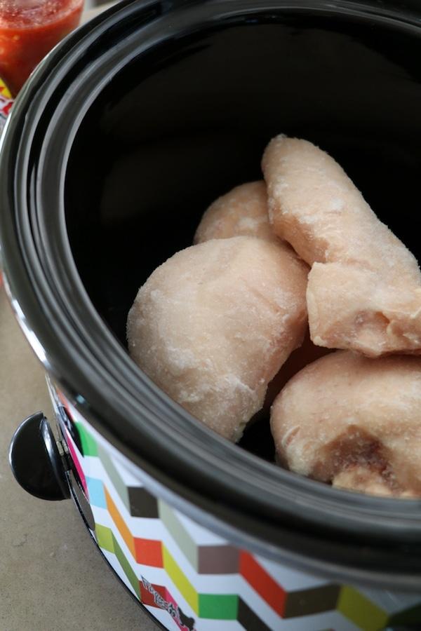 raw chicken in a crockpot