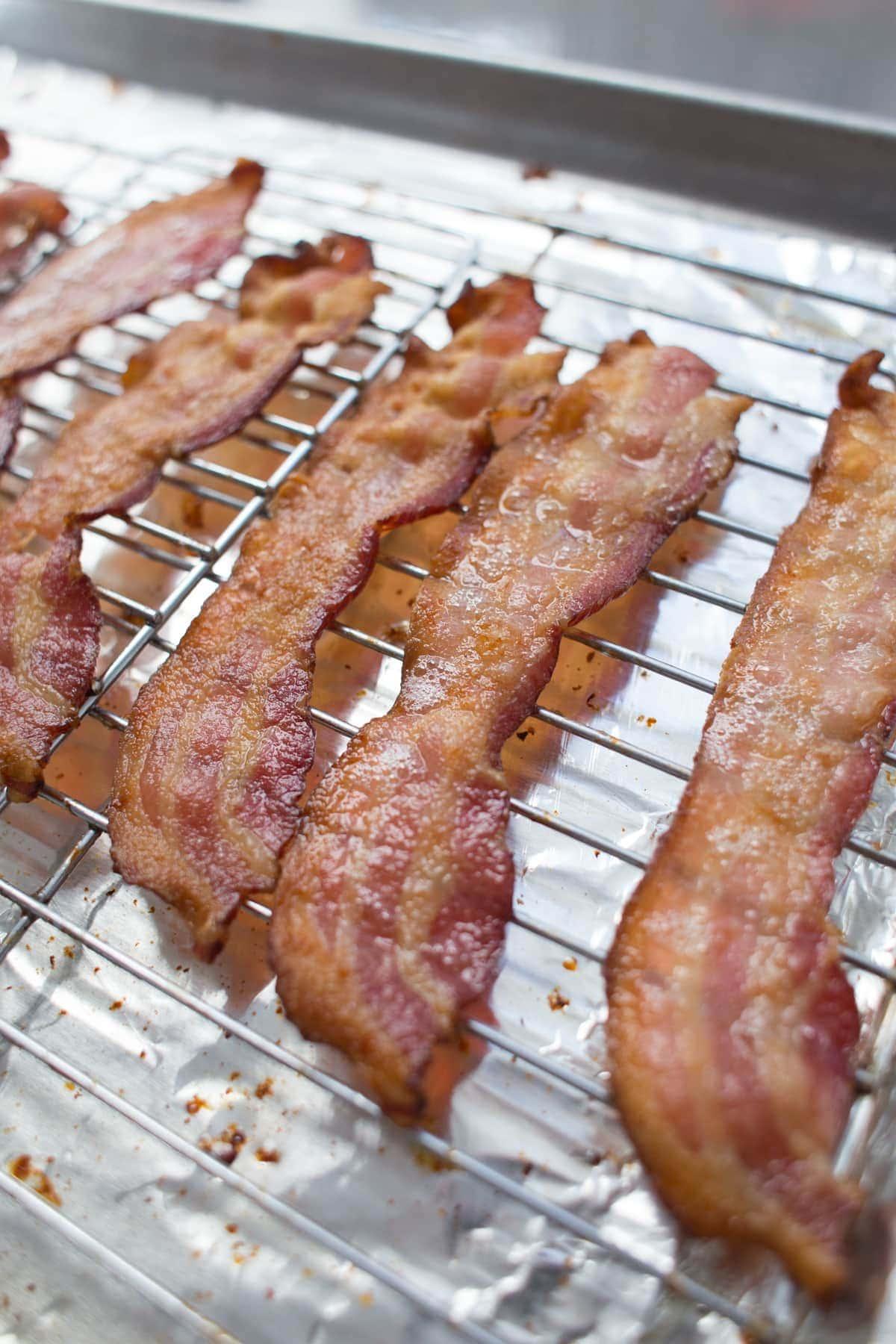 cooked bacon on baking sheet with rack