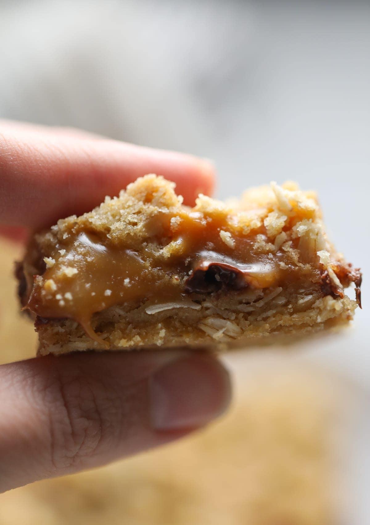 hand holding a carmelita bar