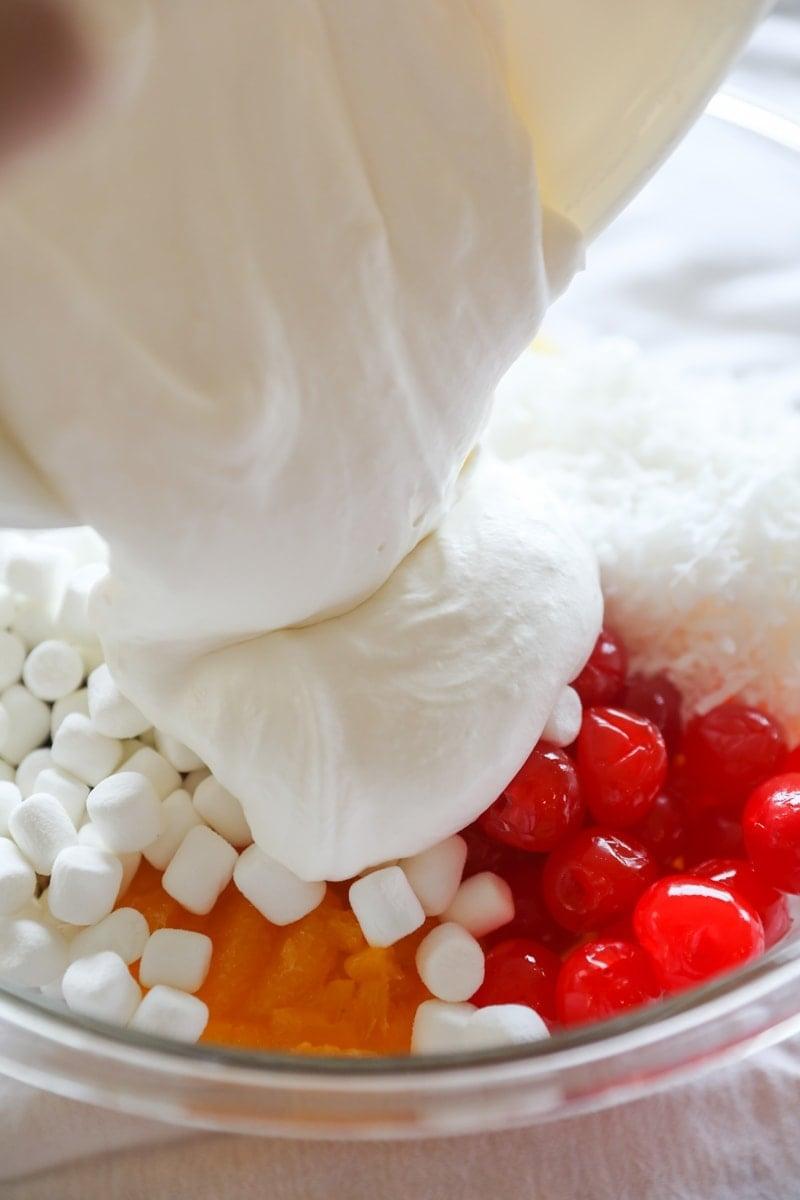 pouring dressing over ingredients