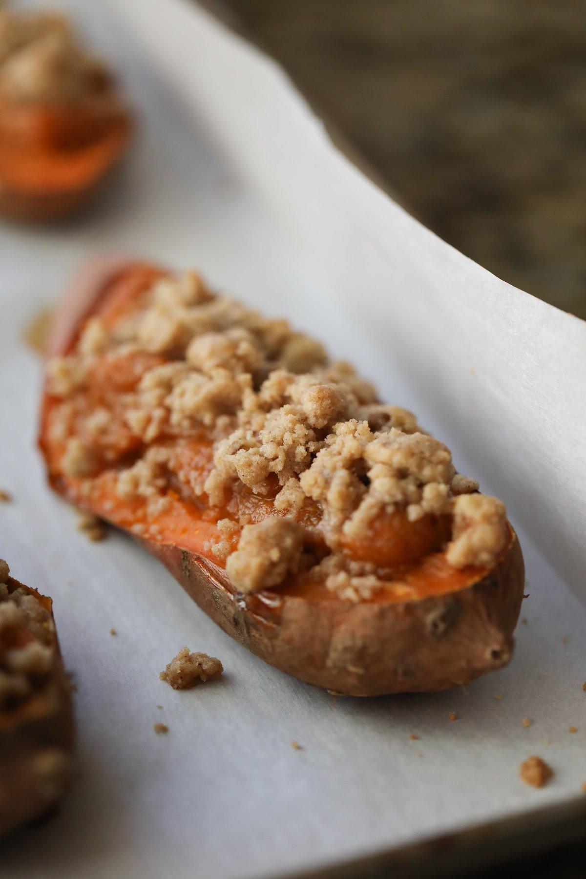 close up photo of twice baked sweet potatoes on baking sheet