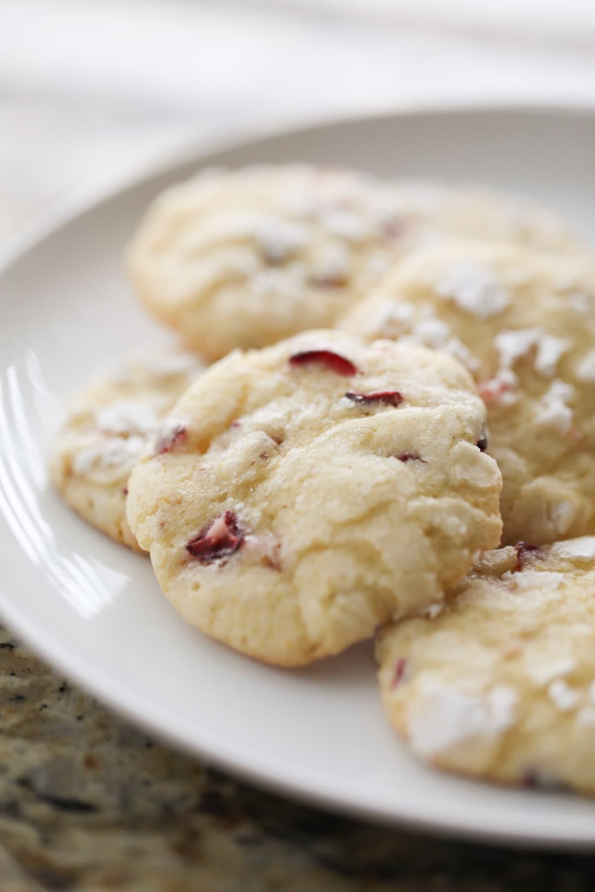 cranberry orange cookies on white plate