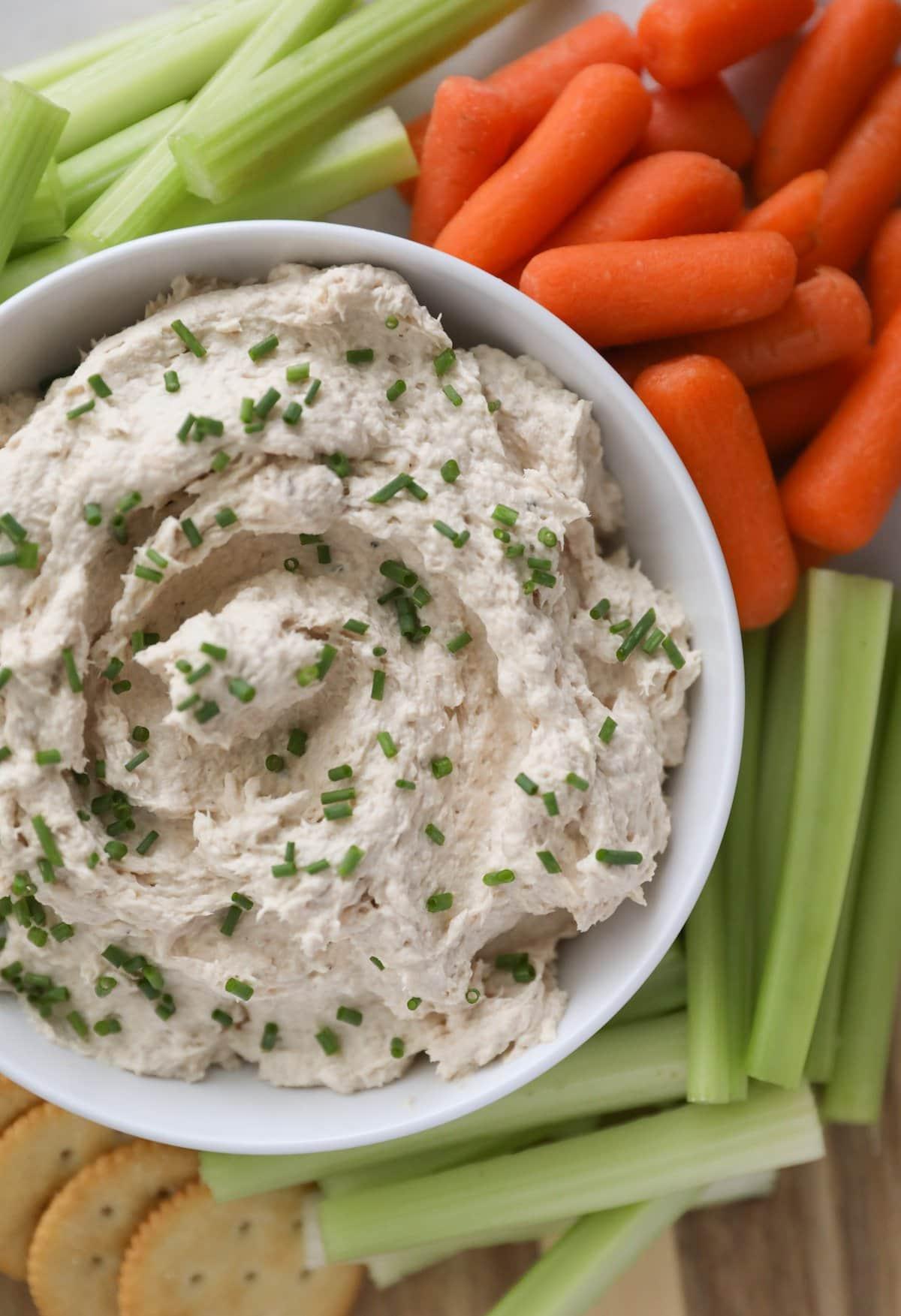 bowl of salmon dip with veggies