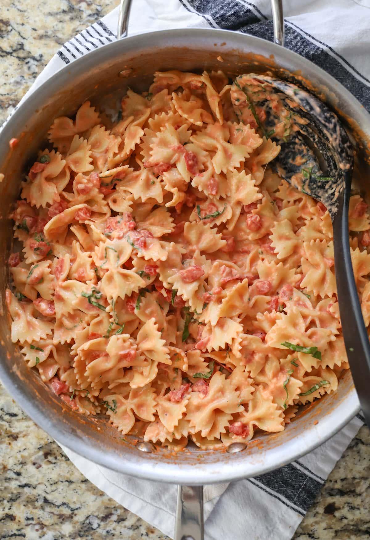 bow tie pasta with sauce in pan