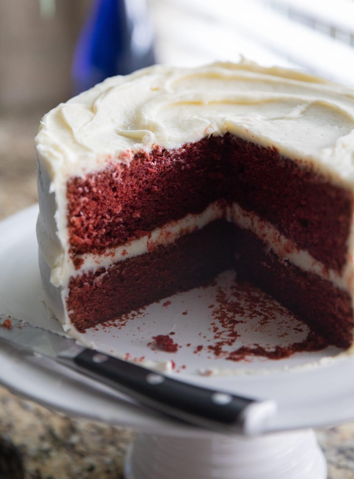 red velvet cake with slices missing