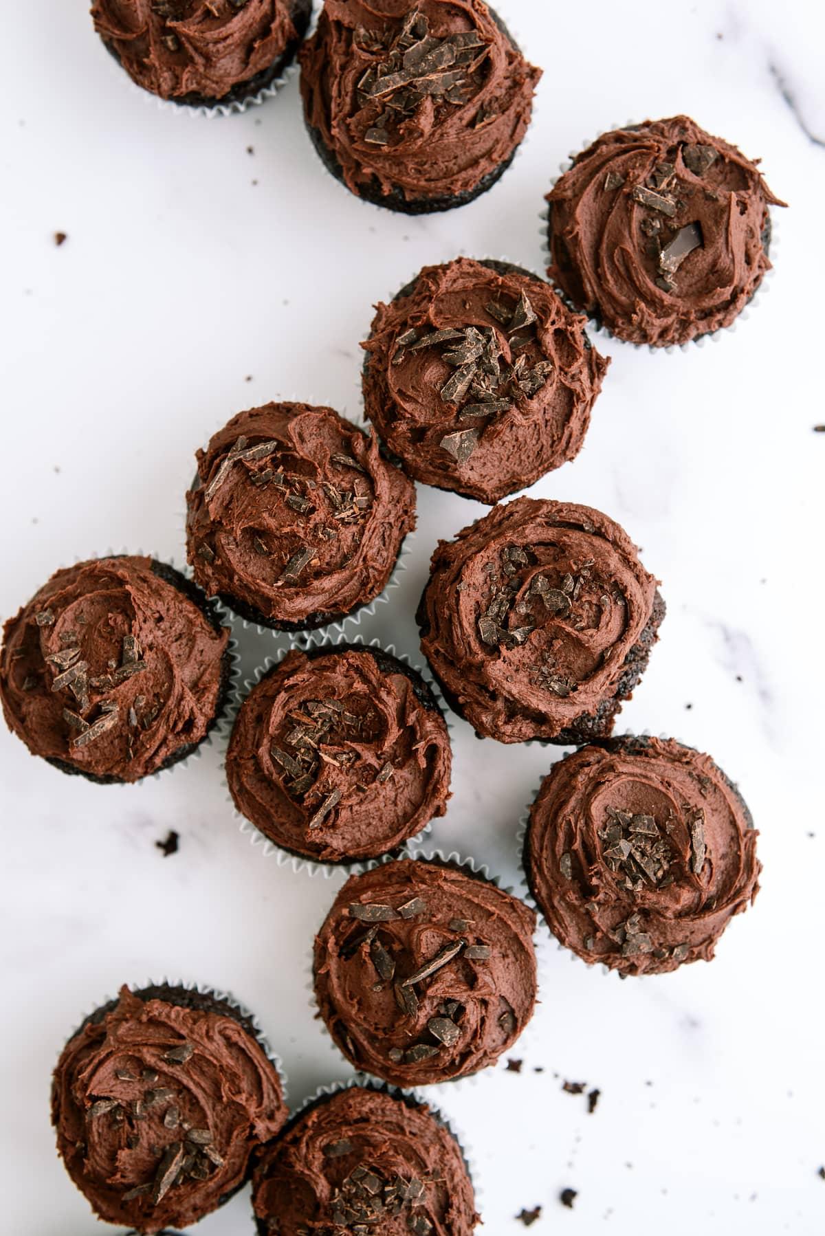 group of chocolate cupcakes with chocolate frosting