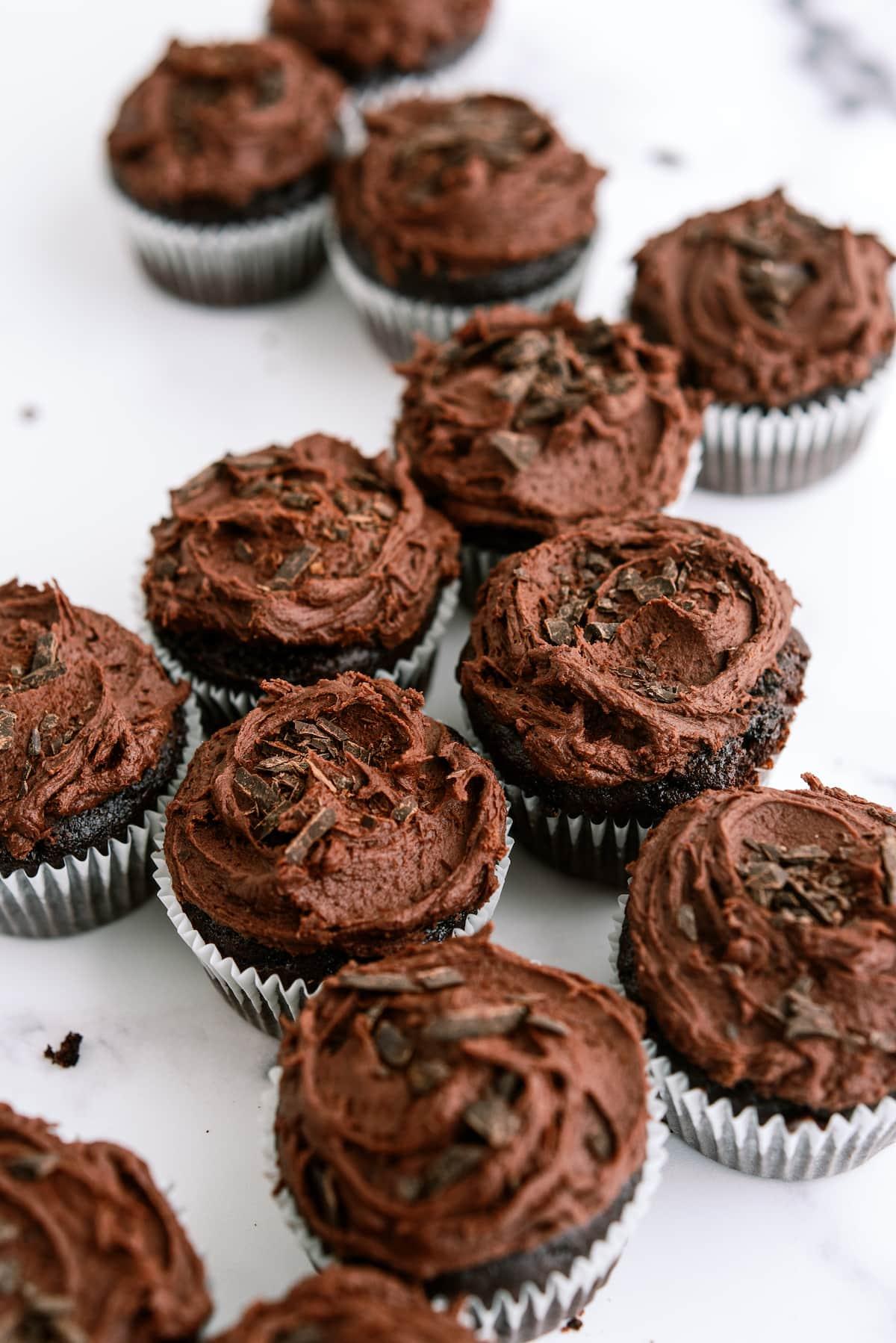 group of chocolate cupcakes with chocolate frosting