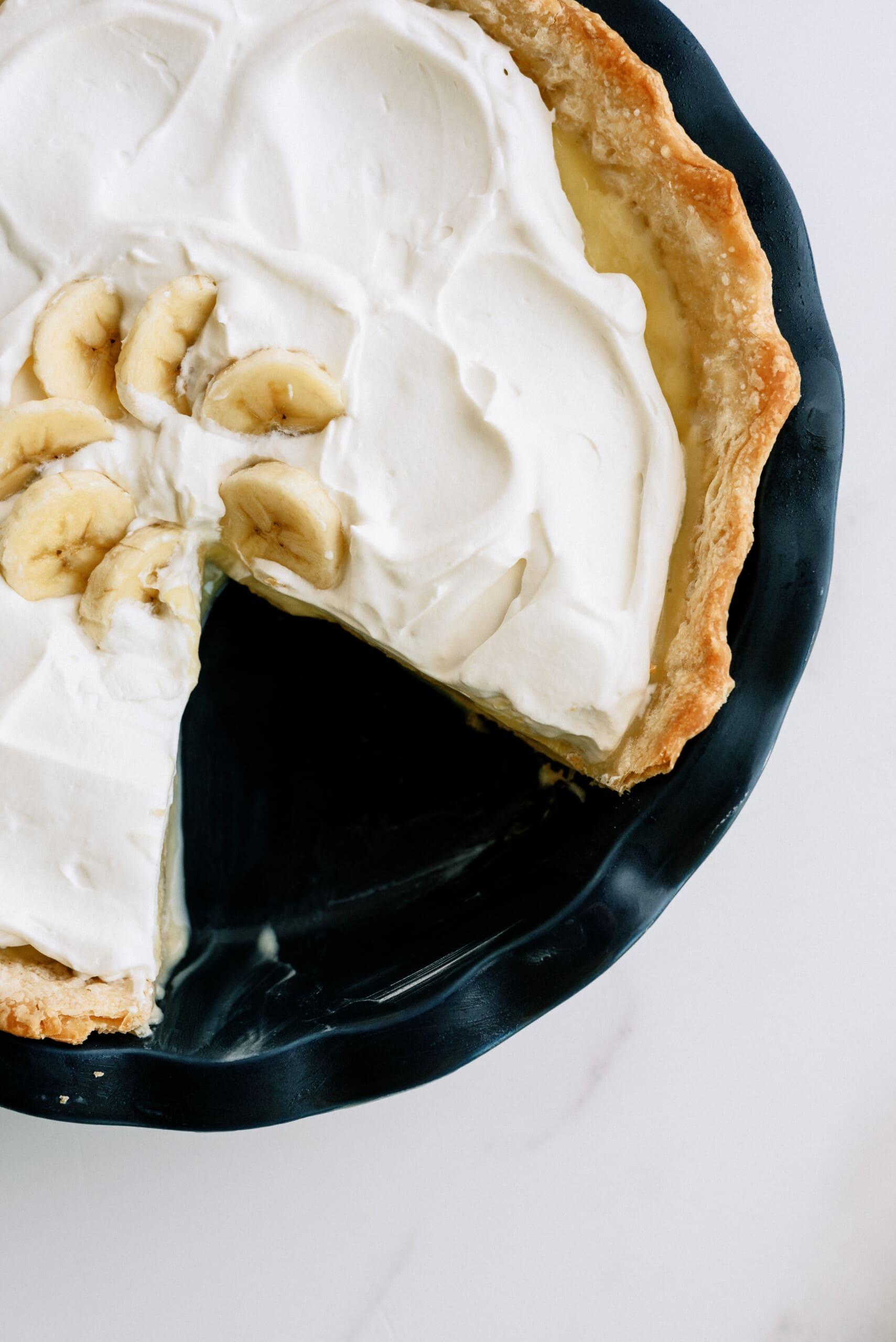 slice taken out of a banana cream pie