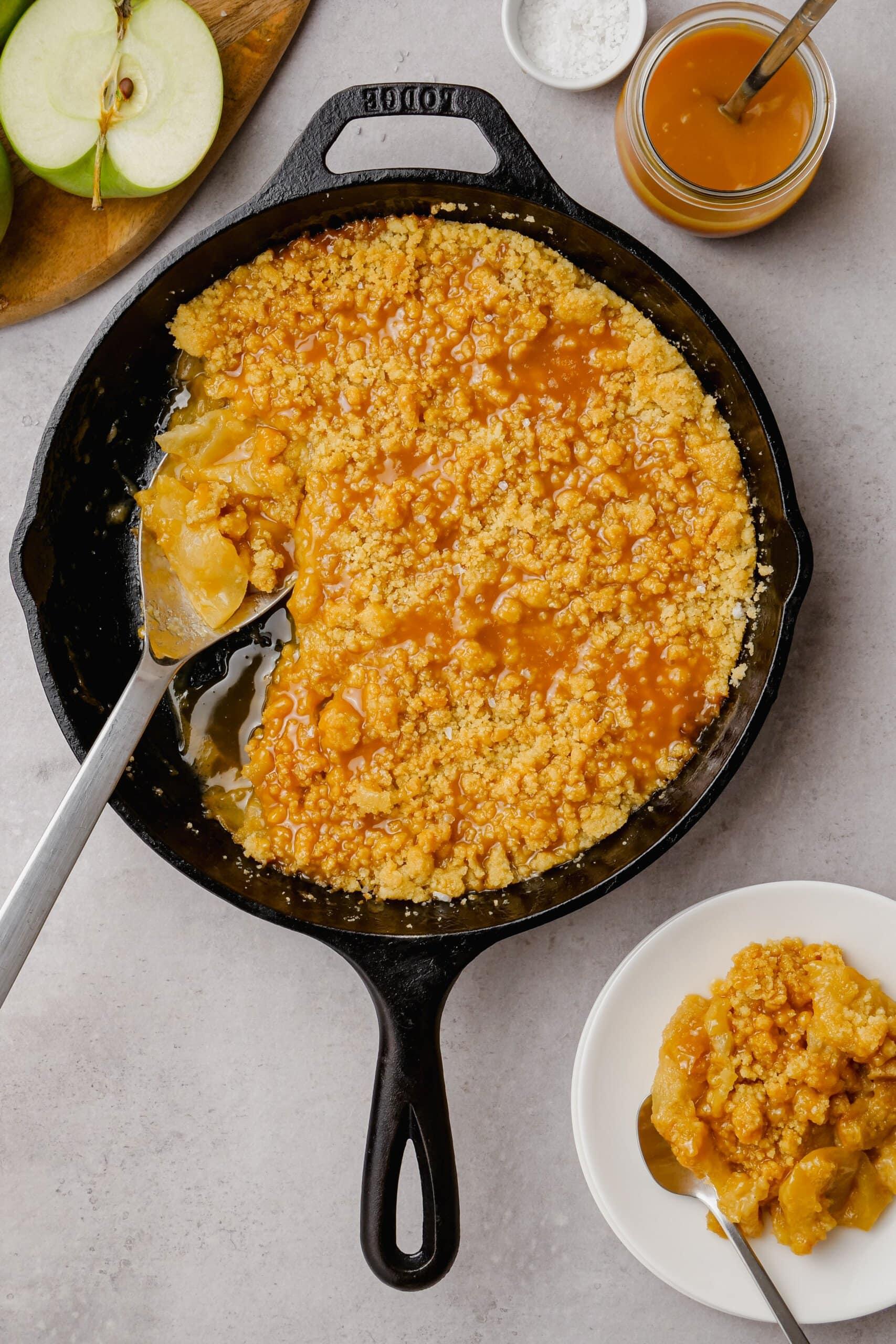 spoon scooping out salted caramel apple crumble