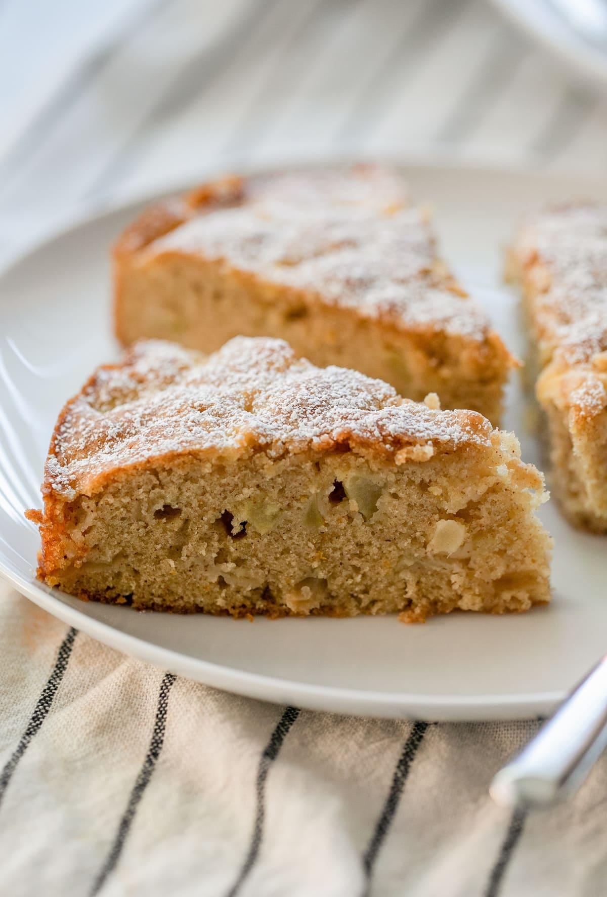 three slices of apple cake on plate