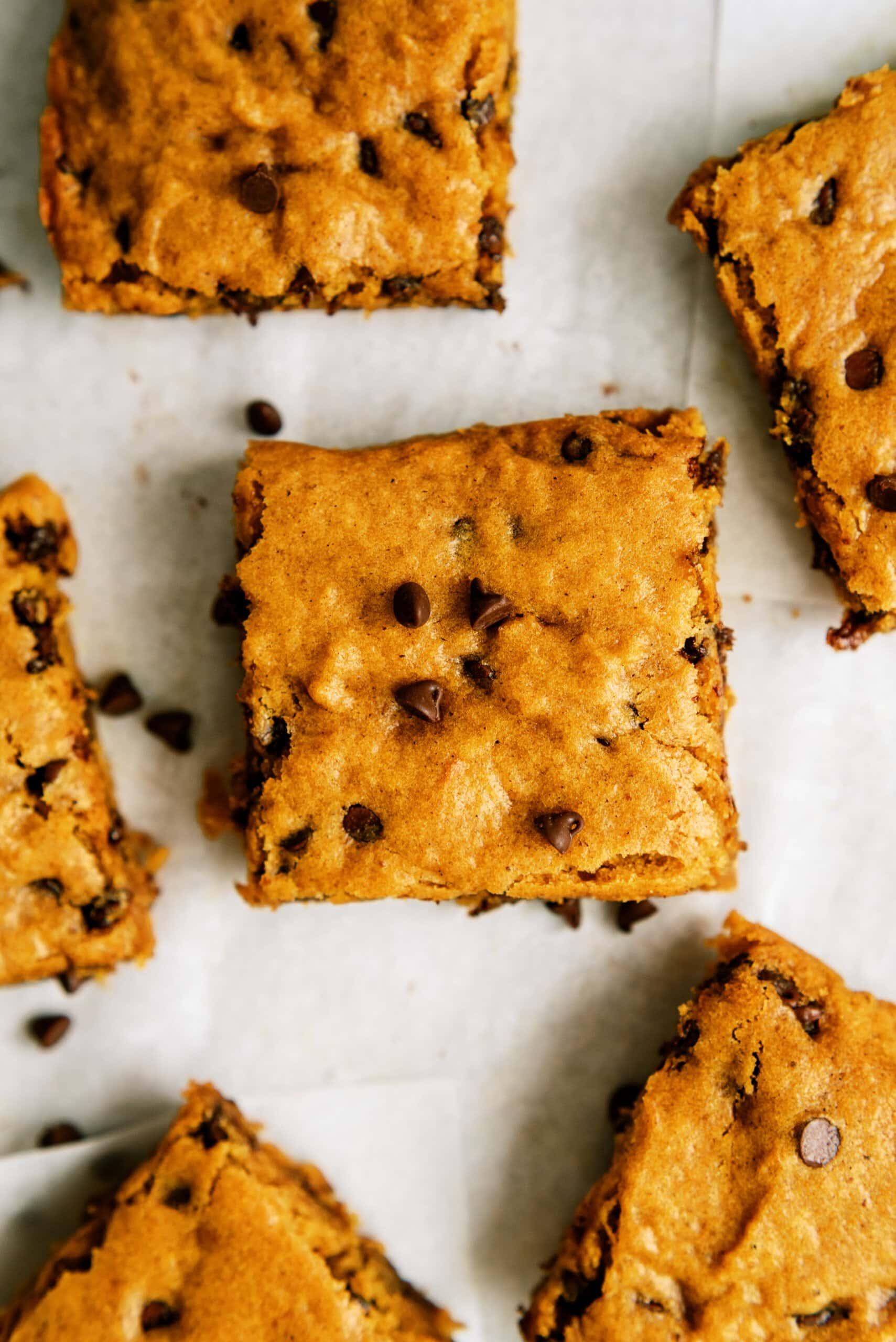 pumpkin chocolate chip bars on parchment paper