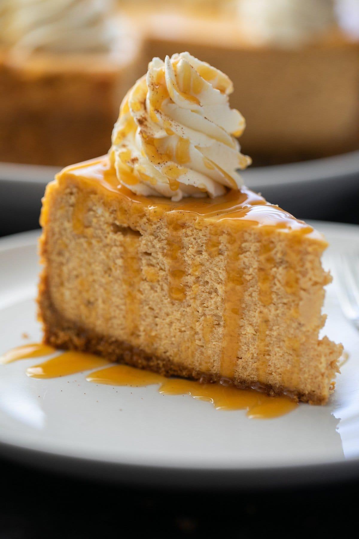 close up of a slice of pumpkin cheesecake