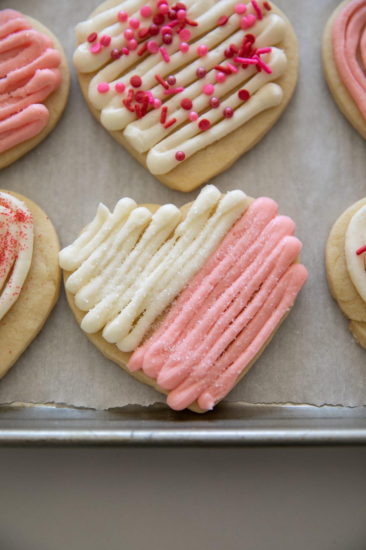 heart valentine sugar cookie with white and pink frosting