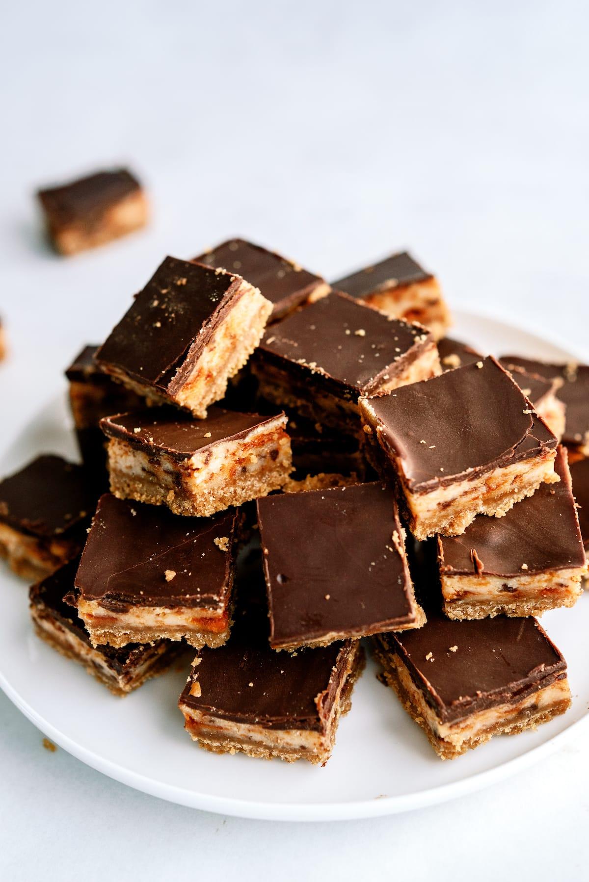 butterfinger nutter butter cheesecake bars on plate