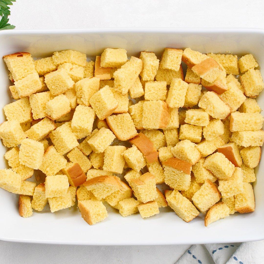 cubed bread in casserole dish