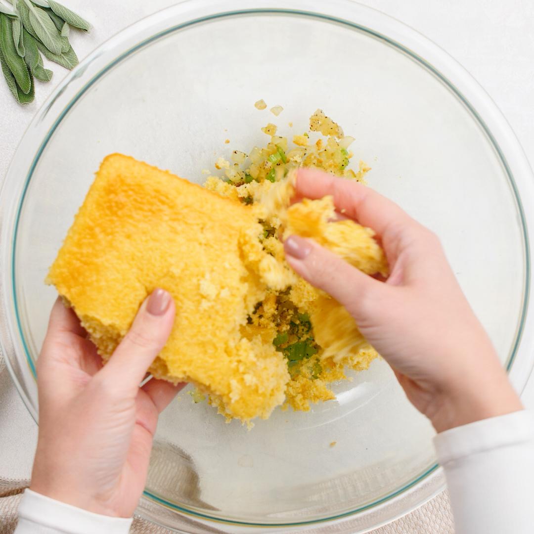 adding cornbread to pan