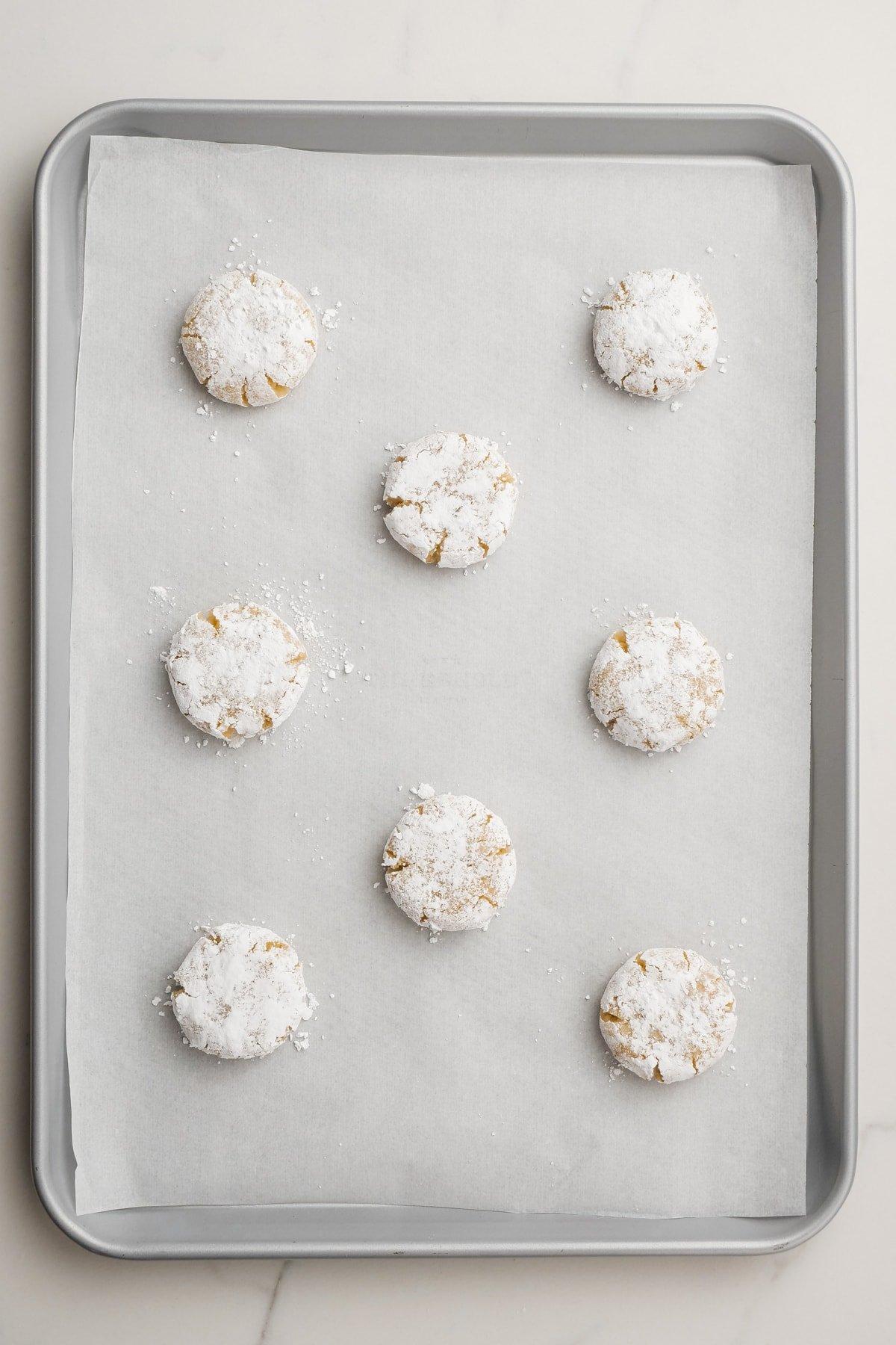 raw amaretti cookies on baking sheet