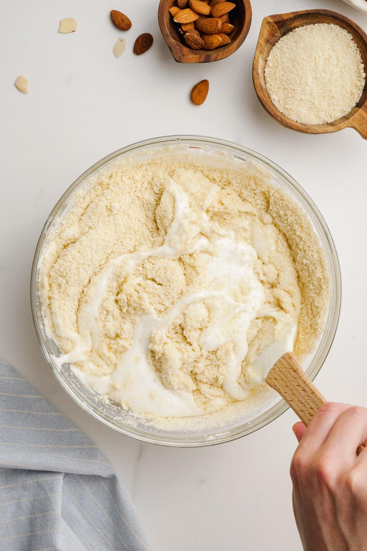 stirring amaretti cookies ingredients in bowl