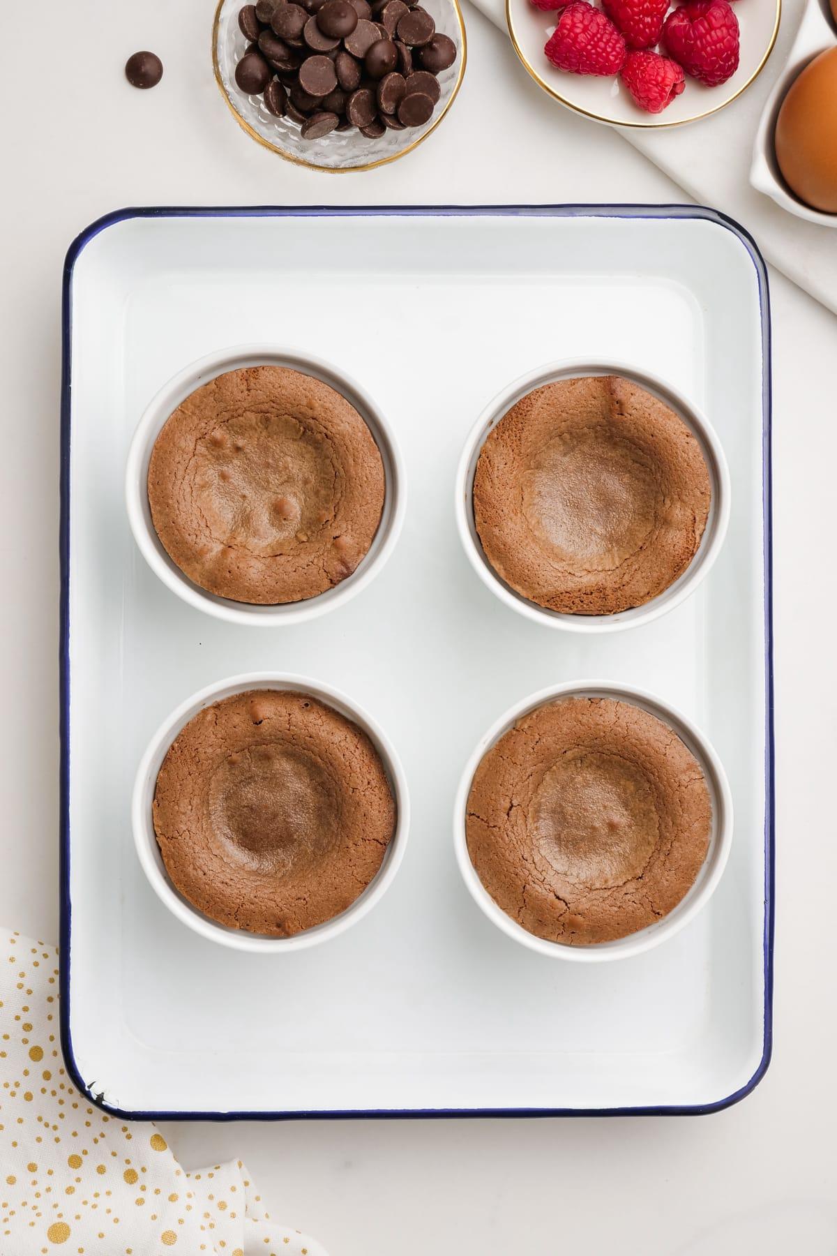 baked molten-lava-cakes in ramekins on baking sheet