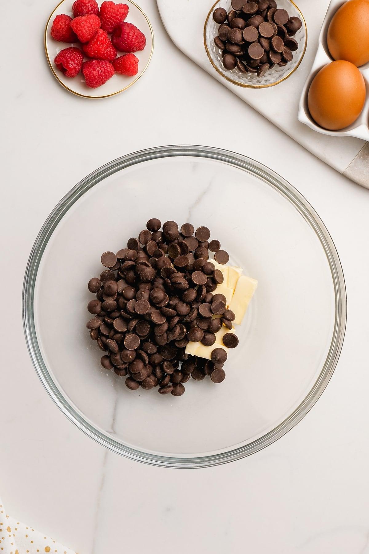 butter and chocolate chips in glass bowl