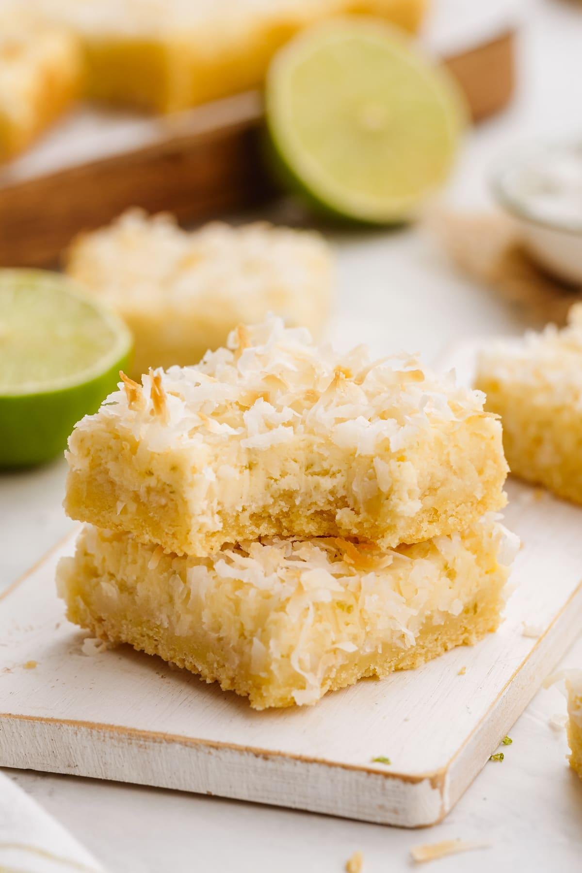 stacked coconut bars with bite taken out of one