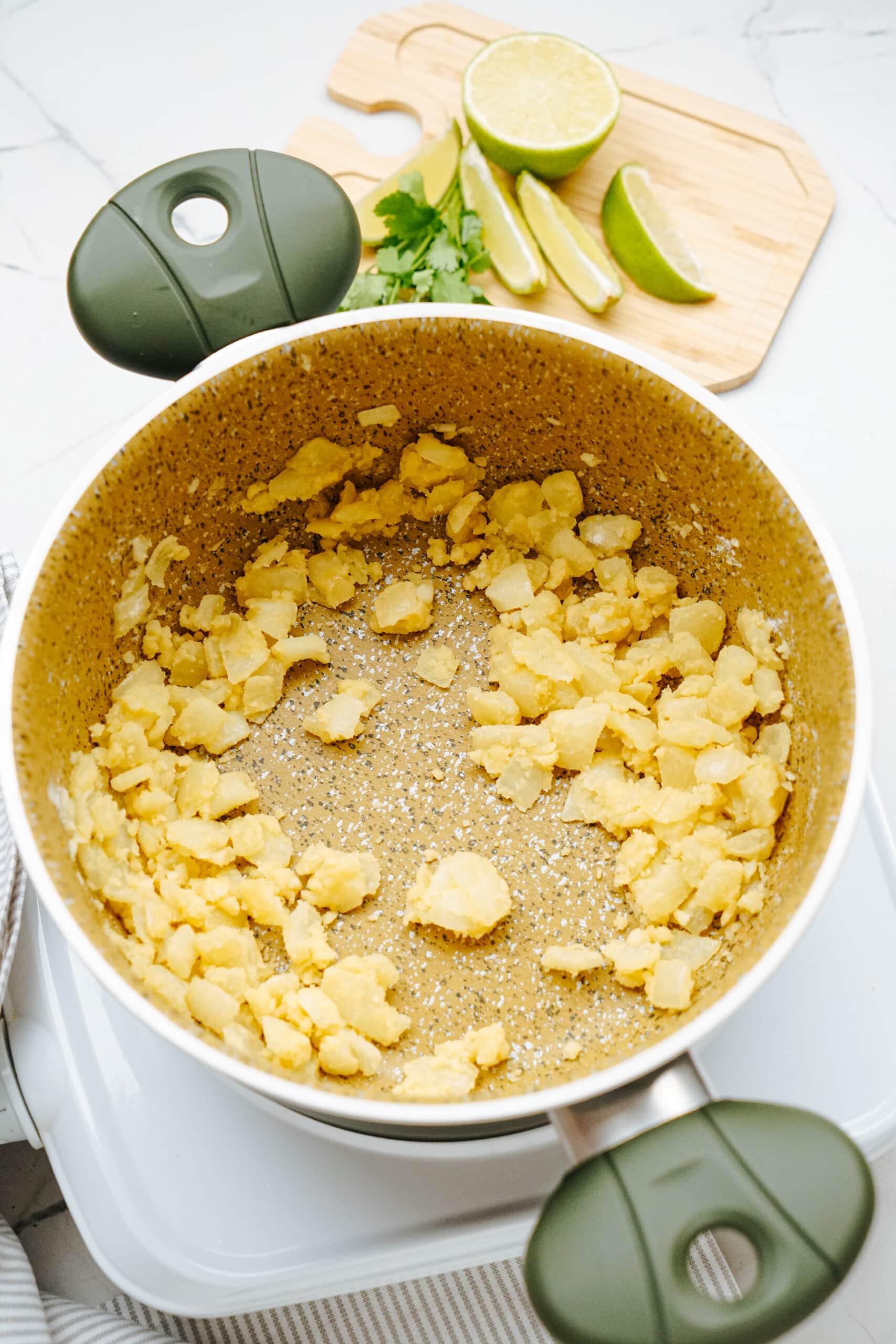 onions, garlic and flour in pot