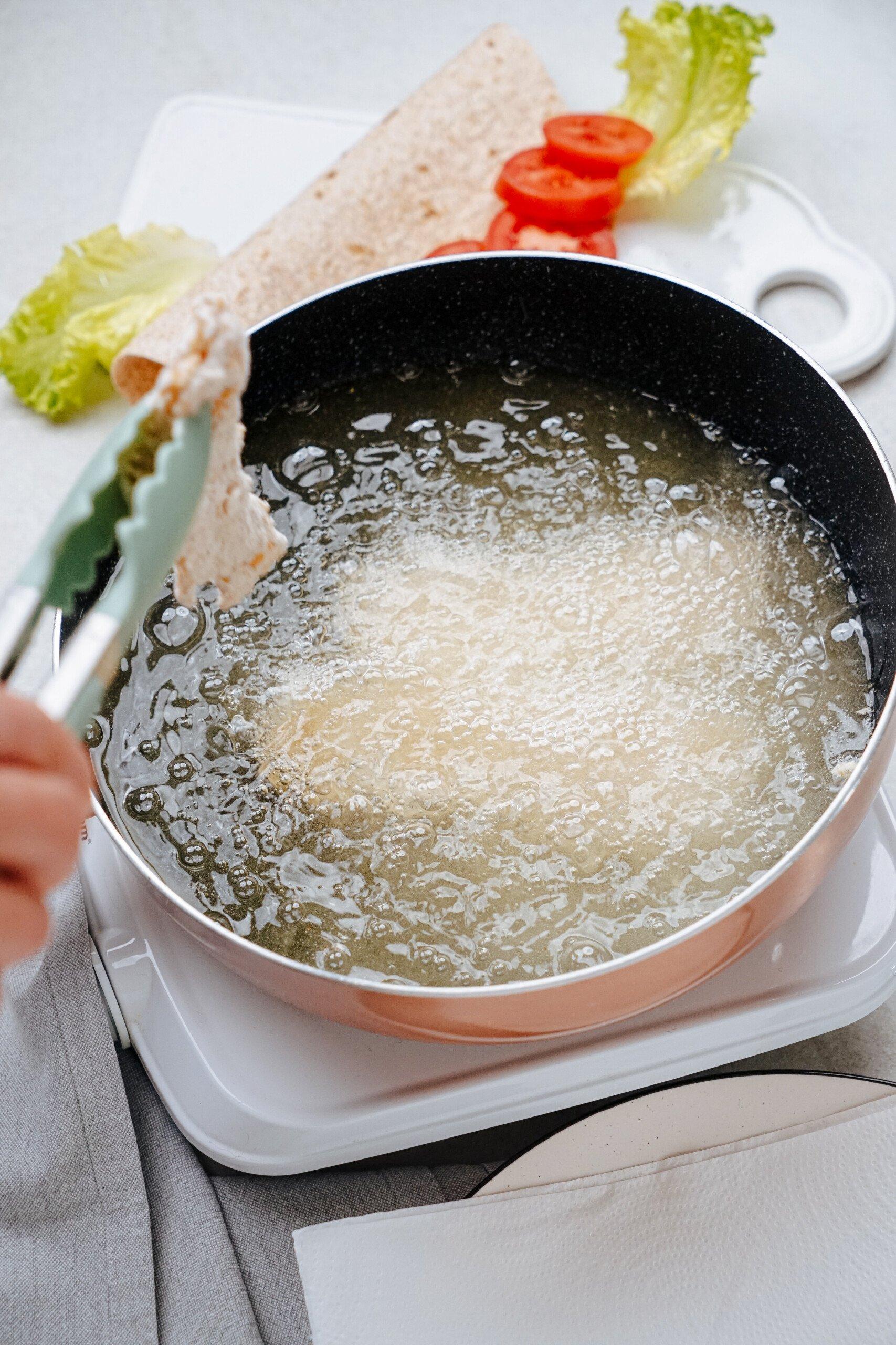 chicken frying in oil