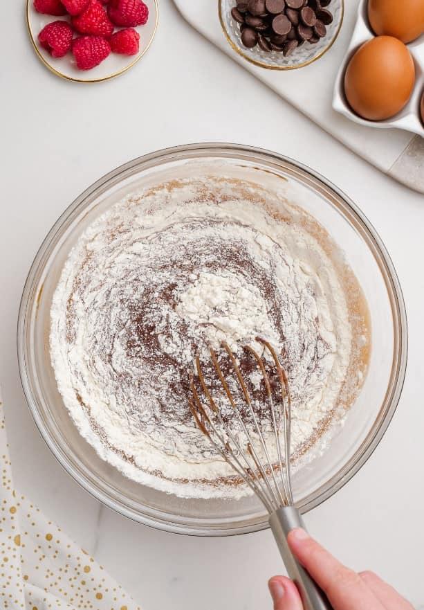 molten lava cake ingredients in glass bowl with whisk