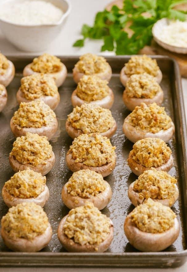 sausage stuffed mushrooms 11 min min uncooked sausage-stuffed-mushrooms on baking sheet