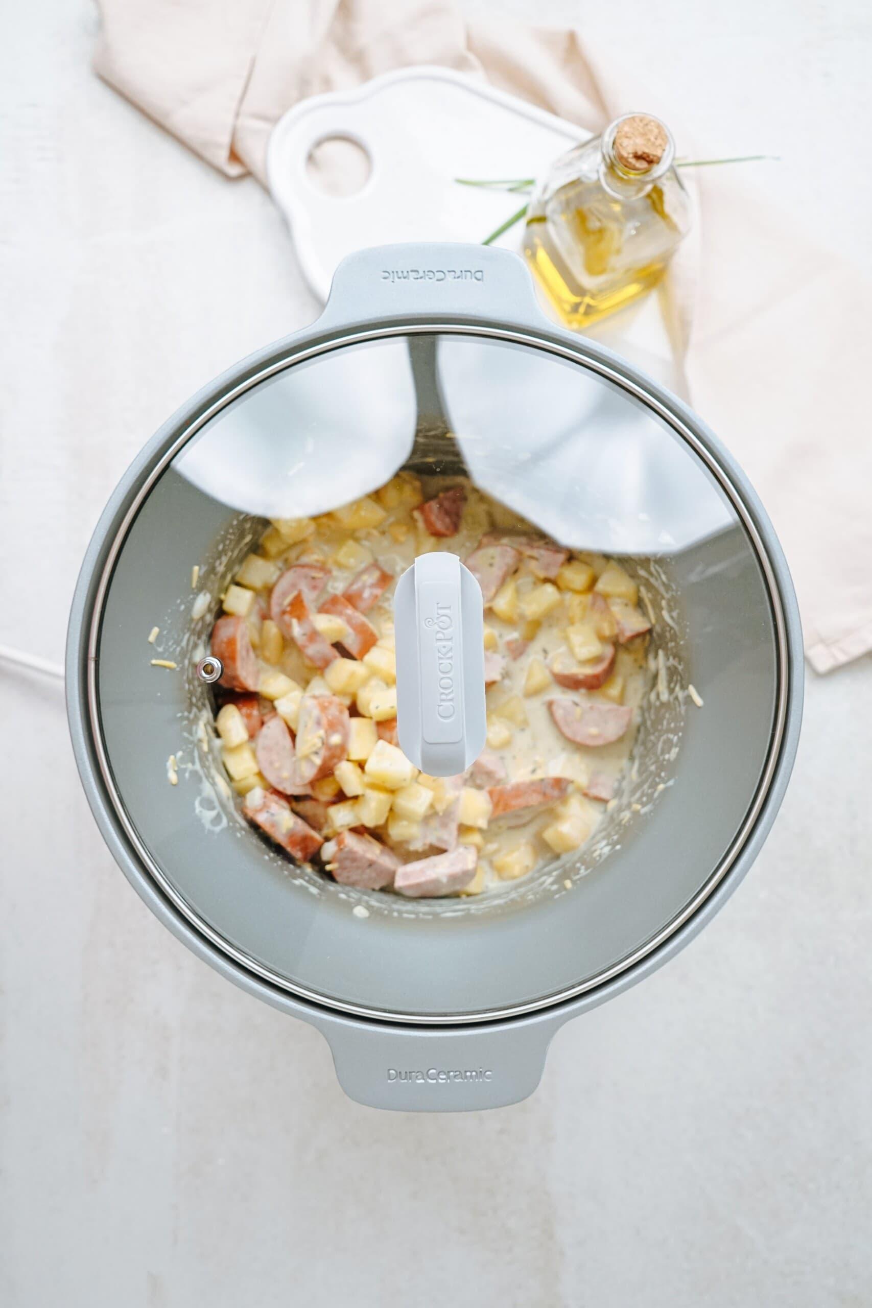 hashbrown casserole in a crockpot with lid