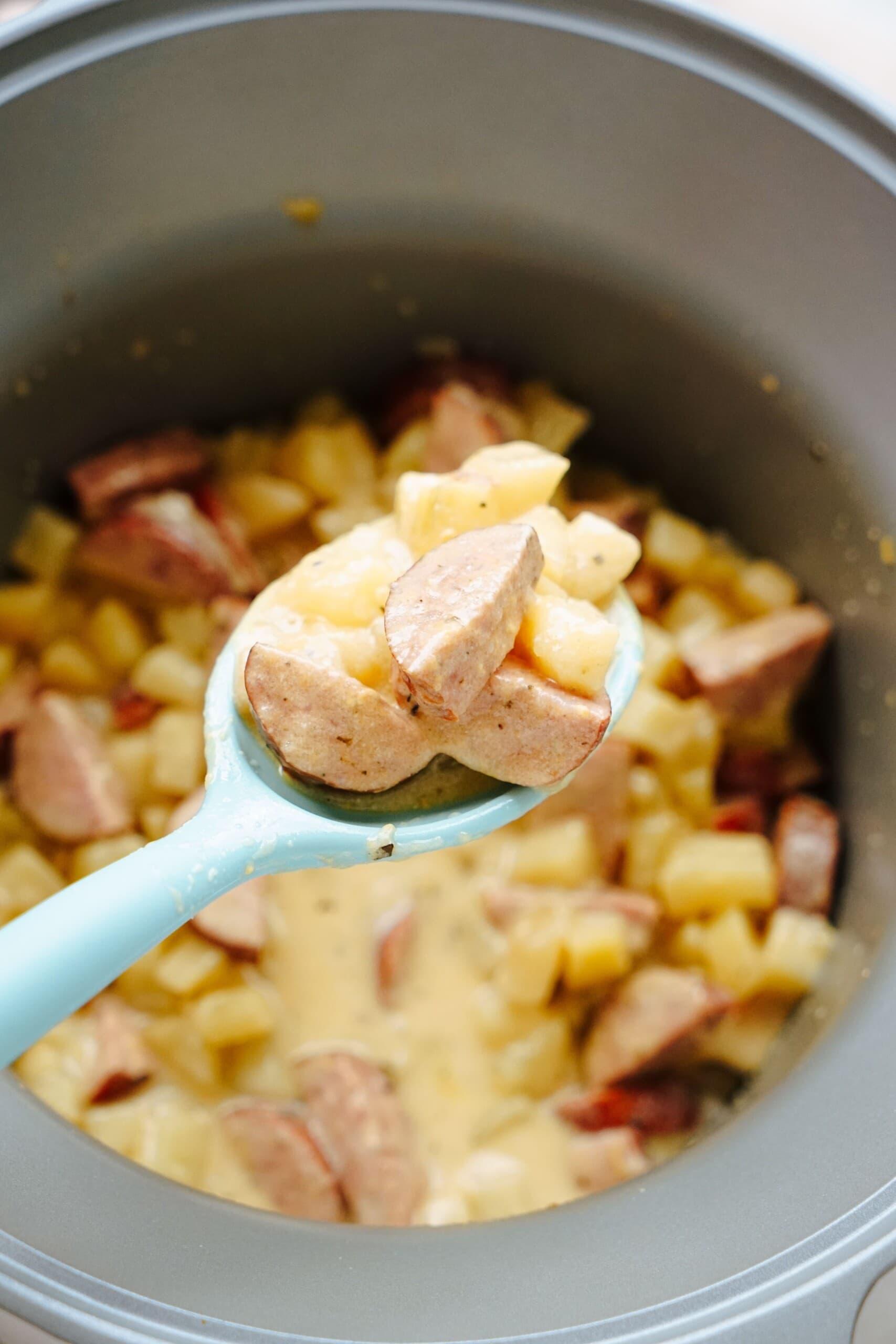 serving spoon with hashbrown casserole