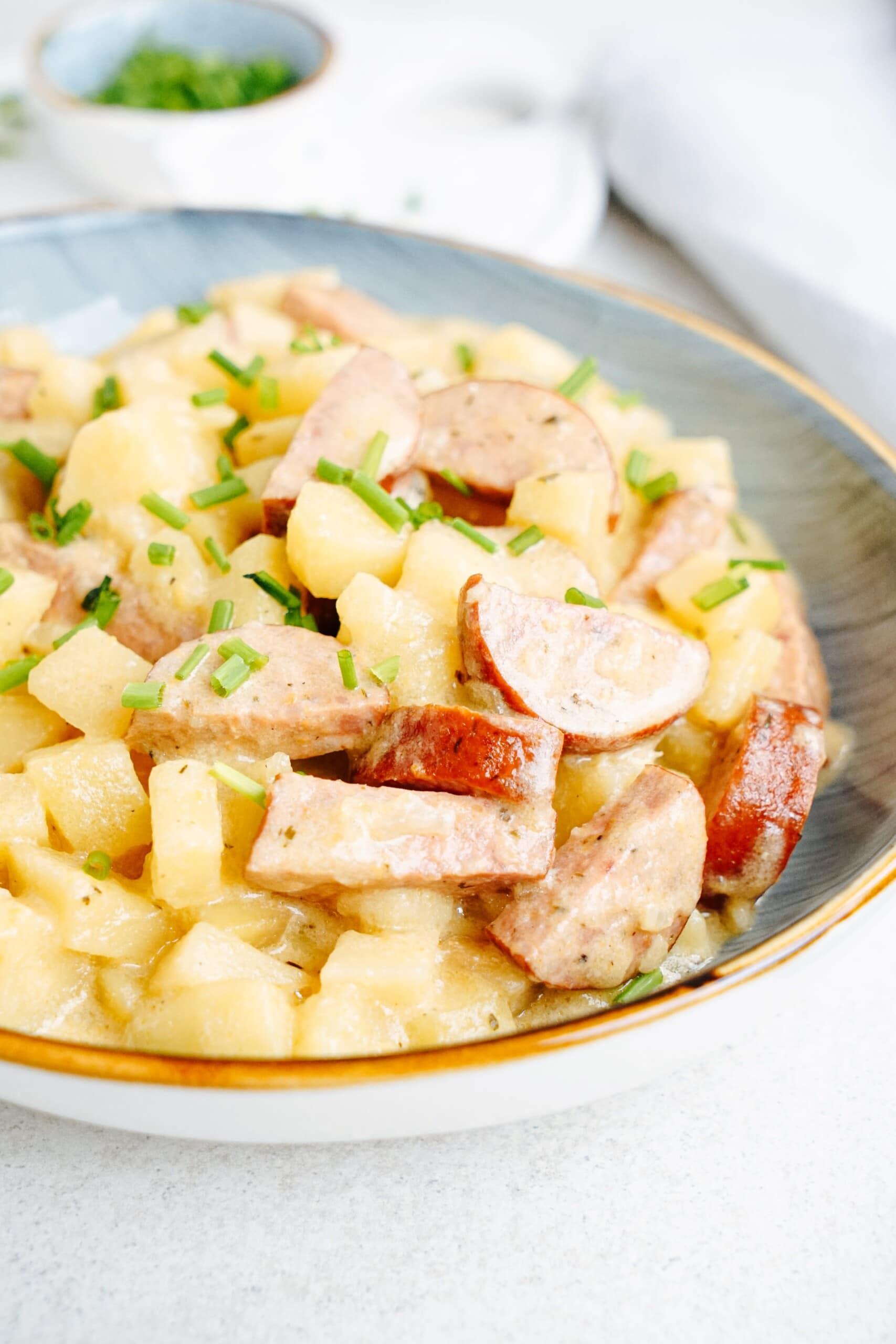 hash brown casserole with smoked sausage in a  bowl