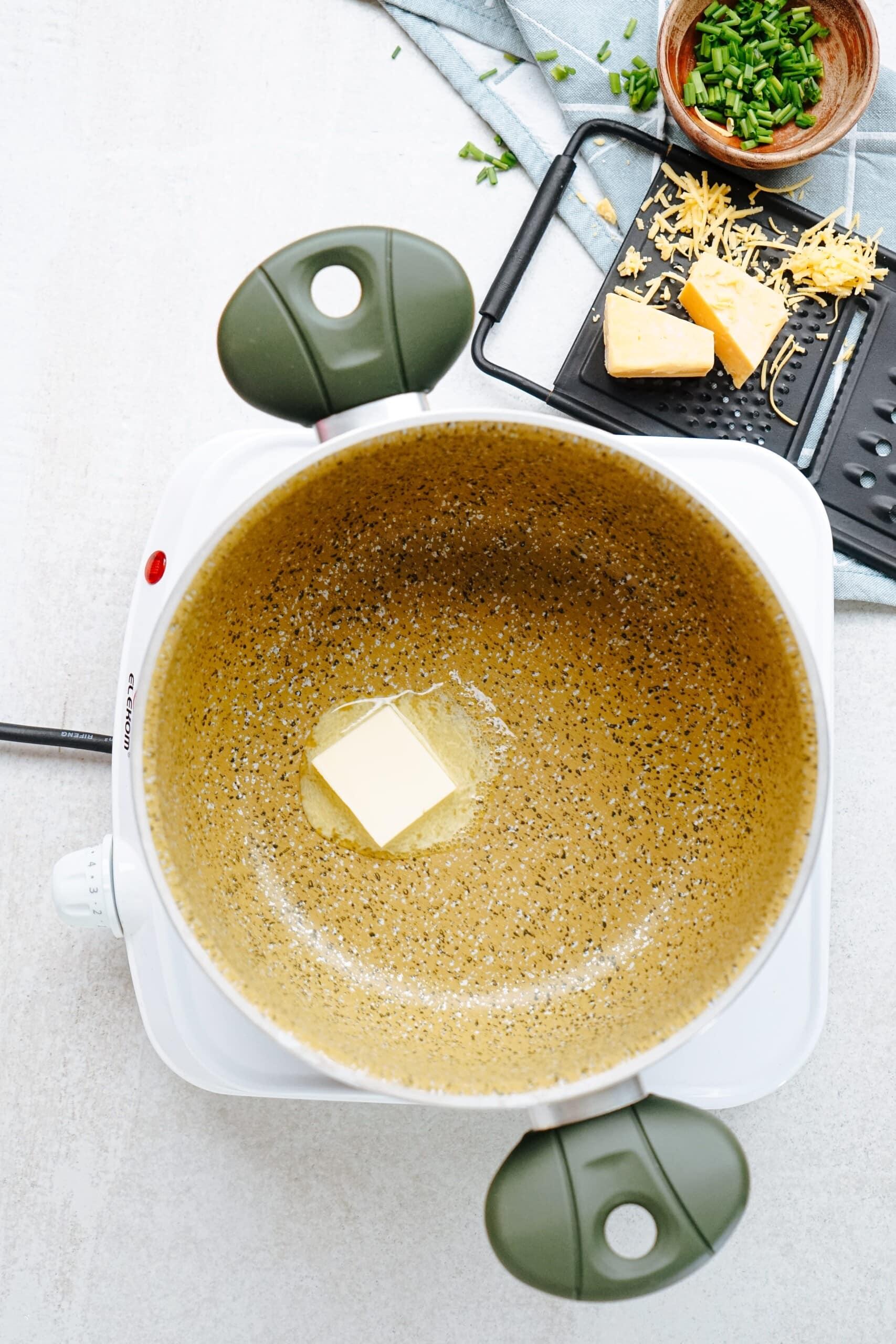 pad of butter melting in saucepan