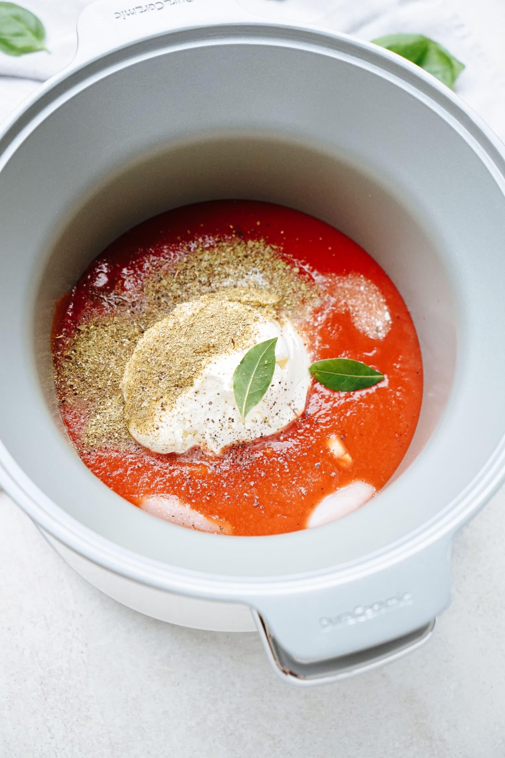 marinara and cream cheese and seasonings in a crockpot