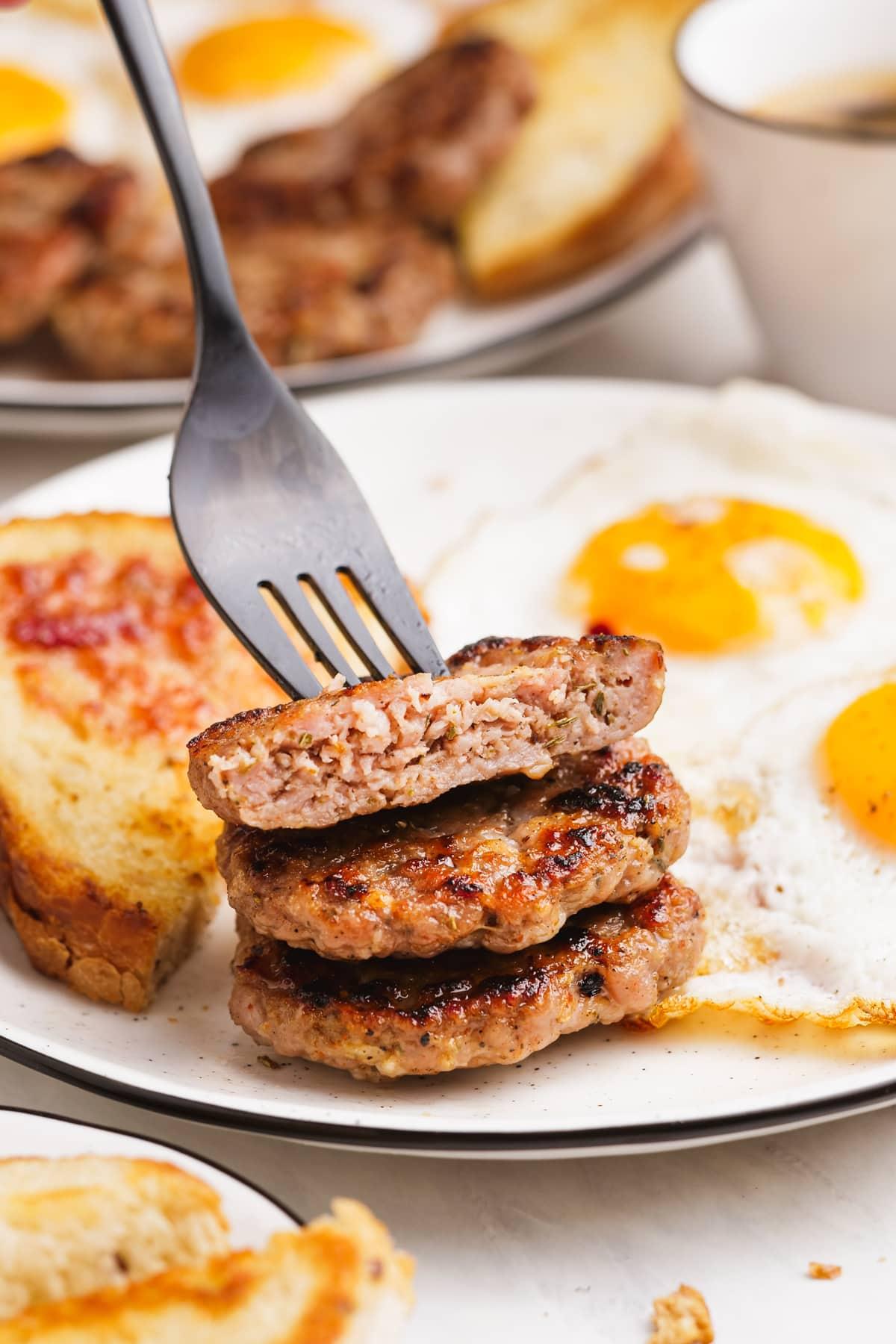 homemade breakfast sausage stacked on a fork