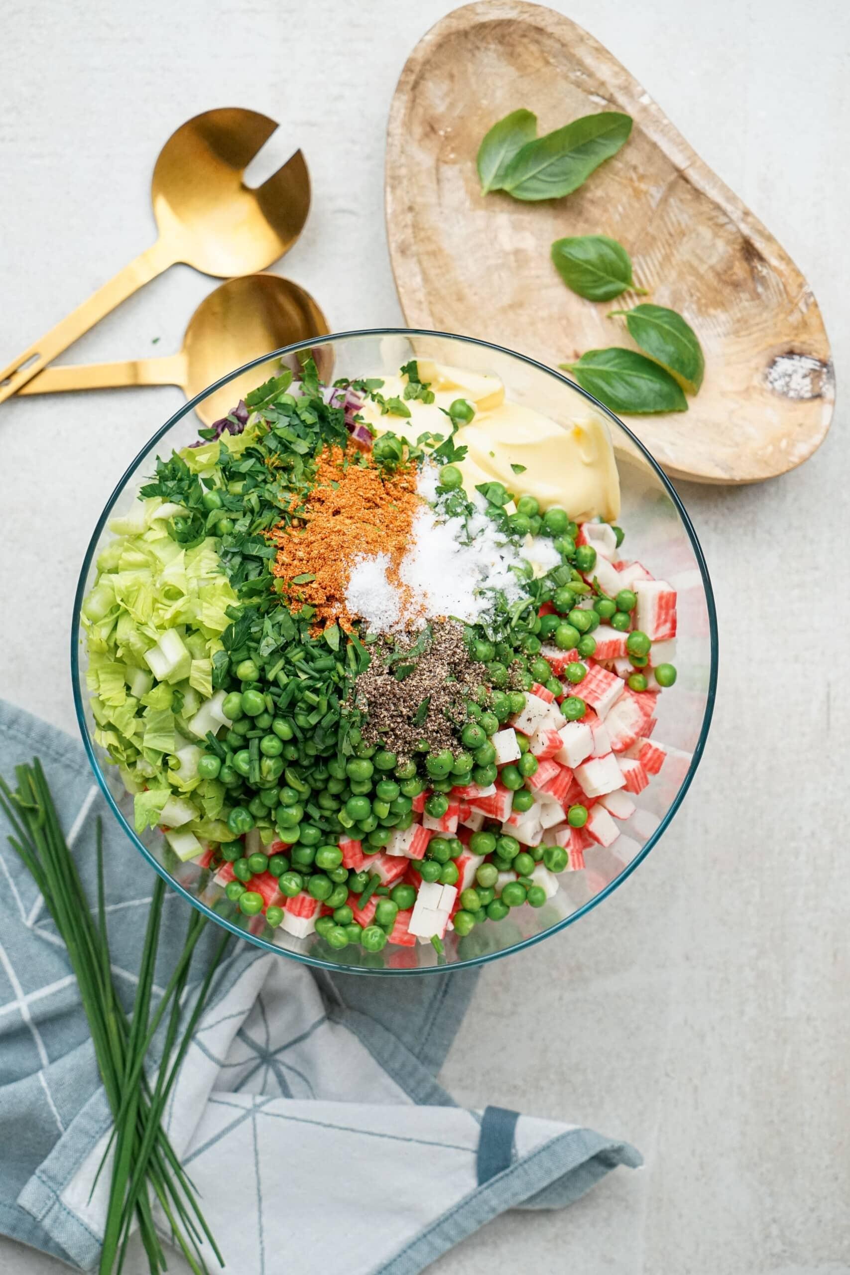 seafood pasta salad ingredients in a bowl